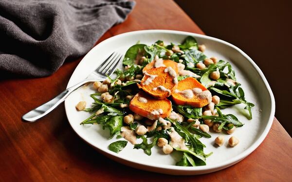 Sweet Potato Medallions with Almond Sauce are served over a Chickpea Salad. (Juli Leonard/Raleigh News & Observer/TNS)