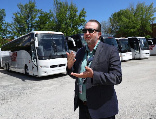 Tom Sambdman, co-owner of Samson Tours whose coaches and school buses sit idle, is waiting for federal relief loans and trying to decide how to use them on Wednesday, April 15, 2020, in Atlanta. The company wants to pay their staff of 72 employees but has no work for them until the summer. Curtis Compton ccompton@ajc.com