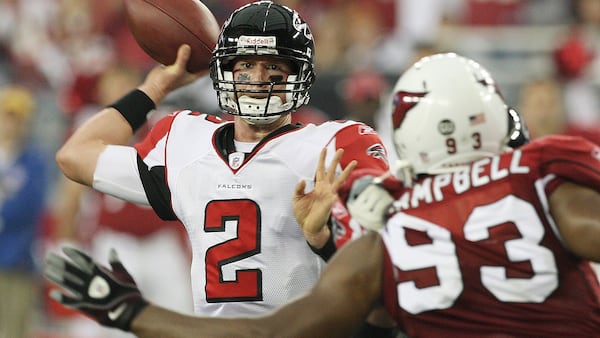 Atlanta Falcons quarterback Matt Ryan (2) throws a pass as Arizona Cardinals defensive end Calais Campbell (93) defends during the second quarter of an NFC Wild Card game Saturday, Jan. 3, 2009 in Glendale, Ariz. (Ross D. Franklin/AP)