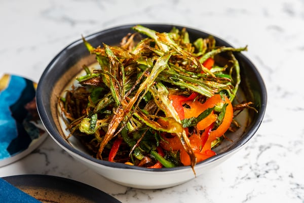 Juniper Cafe serves an appetizer of airy, paper-thin fried okra, cut lengthwise, and seasoned with nuoc cham salt. Courtesy of Eric Sun