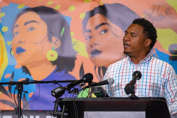 Robert Peterson, the son of March 16 victim Yong Ae Yue talks to the crowd during the Asian Justice 1-year anniversary of the spa shootings rally in Atlanta on March 16, 2022.   STEVE SCHAEFER FOR THE ATLANTA JOURNAL-CONSTITUTION