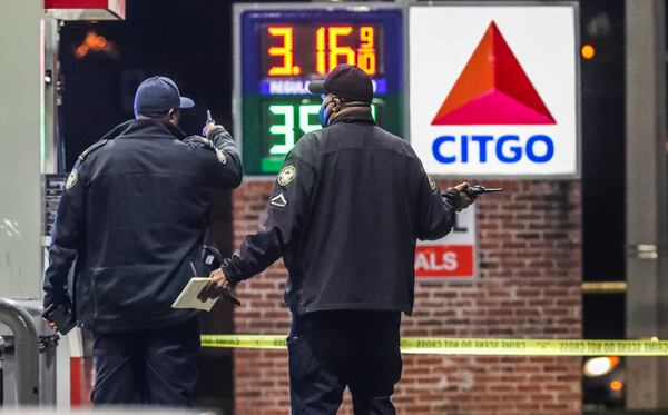 November 2, 2021 Atlanta: Atlanta police are investigating after a woman was found shot to death early Tuesday morning, Nov. 2, 2021 at a northwest Atlanta gas station. The shooting occurred along Sandy Creek Drive, but police responded to a Citgo gas station on Martin Luther King Jr. Drive shortly before 2 a.m. regarding the wounded woman. She was dead when officers arrived. Her name was not released. A gray Jeep was part of the crime scene and investigators had its doors open. Authorities did not say if the woman drove the Jeep from Sandy Creek Drive to the gas station or if she was found inside it. Police said witnesses at the gas station were cooperative but did not say if they saw the shooting. (John Spink / John.Spink@ajc.com)

