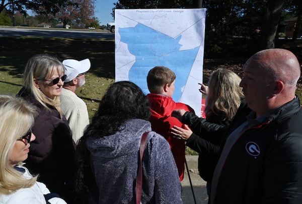 Residents look at a proposed map of City of Mill Creek at Hamilton Mill Community, Friday, November 3, 2023, in Dacula. (Hyosub Shin / Hyosub.Shin@ajc.com)