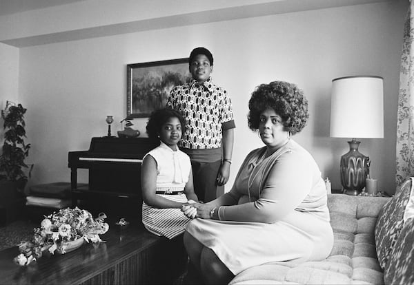 In this April 30, 1974, file photo, Linda Brown, right, and her two children pose for a photo in their home in Topeka, Kan.  