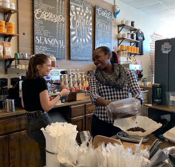 Corner Cup staffers Lola Jameson (left) and Jocelyn Rollins share a laugh at the shop. Many of the folks who work there are former customers. CONTRIBUTED BY OLIVIA KING