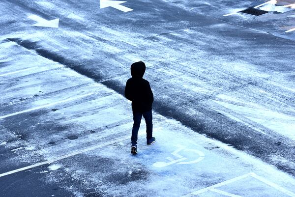 January 7, 2017 Suwanee - A shopper returns to his car on icy Assi Plaza parking lot in Suwanee on Saturday, January 7, 2017. Snow fell in parts of Georgia on Friday night, but much of metro Atlanta got very little or no snow at all. Still, many areas Saturday are facing icy conditions on the roads. There is a danger of slick conditions on bridges and overpasses, Channel 2 Action News meteorologist Karen Minton said.  HYOSUB SHIN / HSHIN@AJC.COM