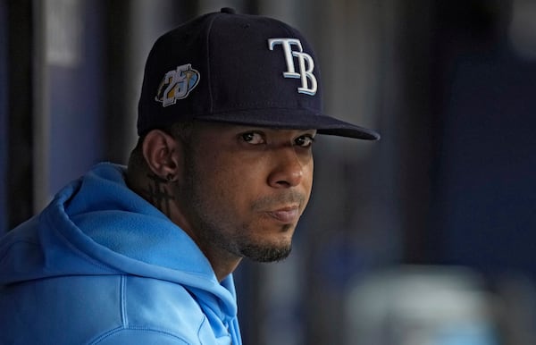 FILE - Tampa Bay Rays shortstop Wander Franco watches from the dugout during the fifth inning of a baseball game against the Cleveland Guardians, Aug. 13, 2023, in St. Petersburg, Fla. (AP Photo/Chris O'Meara, File)