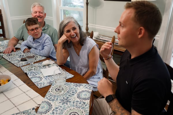 Steve and Dale Tingle listen to stories from Kevin Krüger during brunch on a Sunday afternoon at their house in Watkinsville, near Athens. This was Krüger’s third visit from Germany to the Tingles, whom he now considers family after Dale Tingle donated stem cells, saving his life. (Miguel Martinez/AJC)