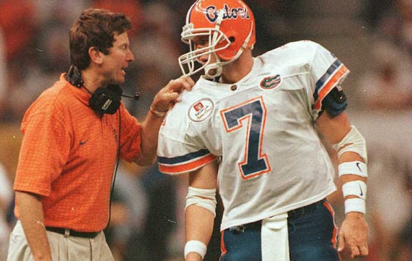 Danny Wuerffel (right) became the second player from the University of Florida to win the Heisman, joining his coach, Steve Spurrier, who was the first. (AJC File)