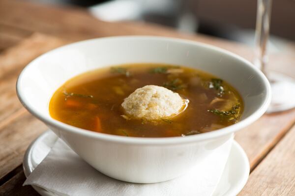  Bubby Muss' Matzo Ball Soup with chicken stock, celery, carrots, and schmaltzy matzo balls. Photo credit- Mia Yakel.