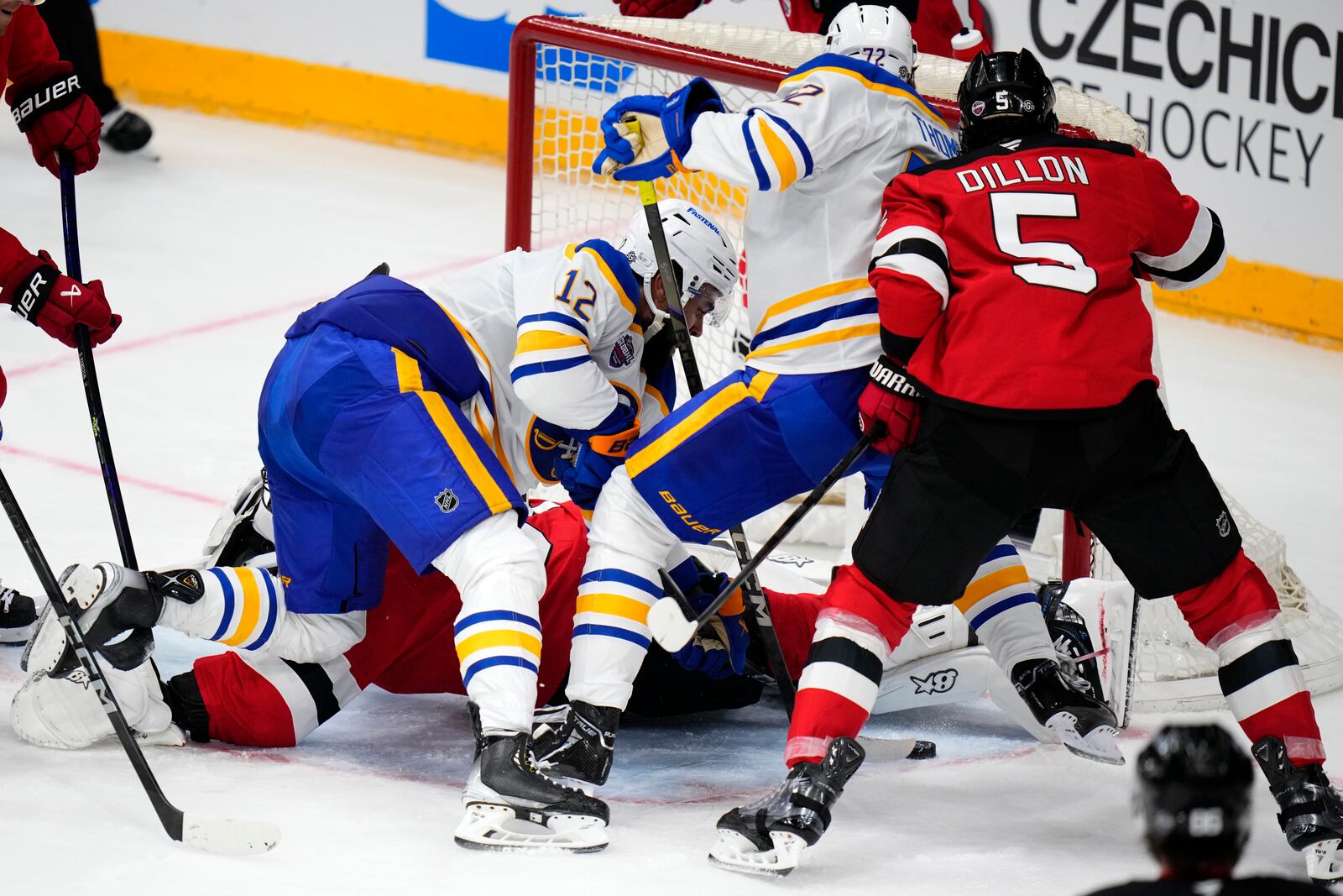 Buffalo Sabres' Tage Thompson, 2nd right, scores his sides first goal during the NHL hockey game between Buffalo Sabres and New Jersey Devils, in Prague, Czech Republic, Saturday, Oct. 5, 2024. (AP Photo/Petr David Josek)