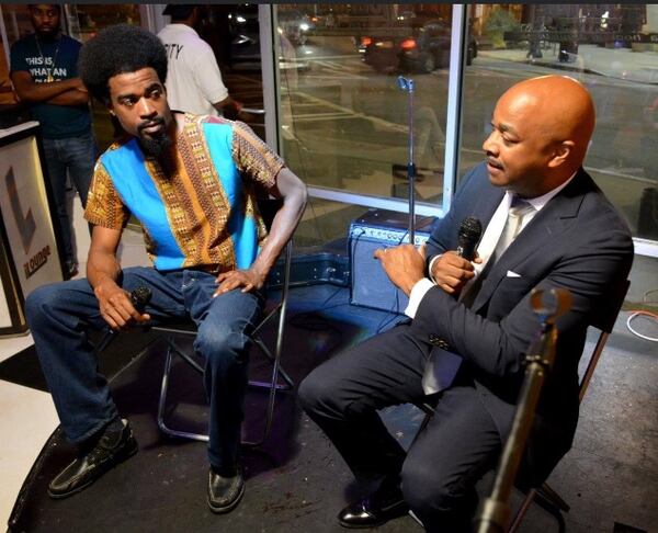 Marc KD Boyd, left, who started the open-mic event Feed a Starving Artist, with Atlanta mayoral candidate Kwanza Hall in 2017. Photo by Spen Spen Fleming