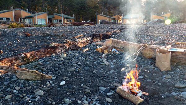 In front of the deluxe cabins at Quileute Oceanside Resort, a breakfast bonfire on First Beach is a good way to greet mornings. Get a $5 beach-fire permit and buy firewood at the resort office.  (BRIAN J. CANTWELL/SEATTLE TIMES/TNS)