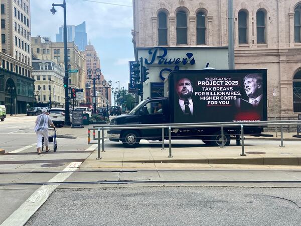 A mobile billboard focusing on Project 2025, funded by Joe Biden's campaign, drives around Milwaukee near the site of the Republican National Convention on Tuesday.