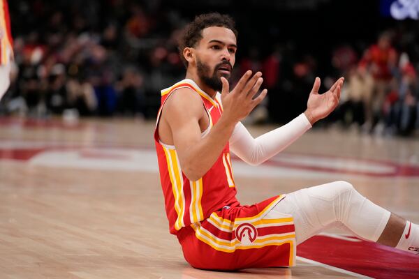 Atlanta Hawks guard Trae Young (11) reacts after a foul in the first half of an NBA basketball game against the Milwaukee Bucks, Tuesday, March 4, 2025, in Atlanta. (AP Photo/Brynn Anderson)