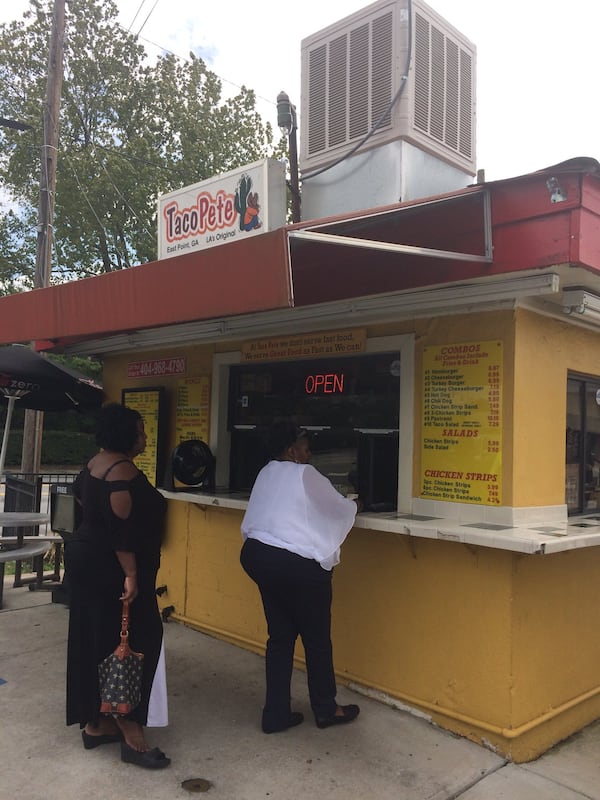 Customers wait in line to order food at Taco Pete in East Point. CONTRIBUTED BY WENDELL BROCK