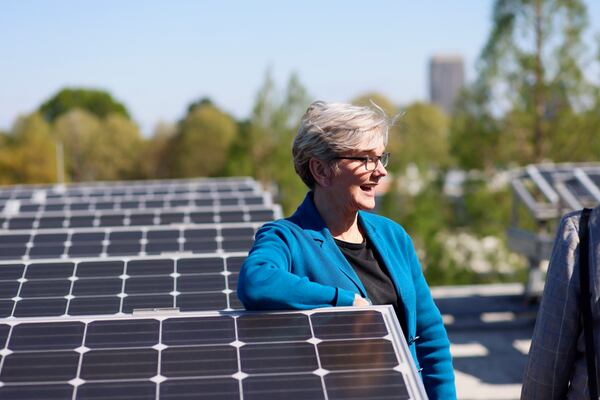 Secretary of Energy Jennifer M. Granholm leans on a solar panel during a tour of the Strategic Energy Institute labs at Georgia Tech on Thursday, April 4, 2024. Project 2025 calls for fewer restraints on use of fossil fuels and less emphasis on renewables. Miguel Martinez /miguel.martinezjimenez@ajc.com