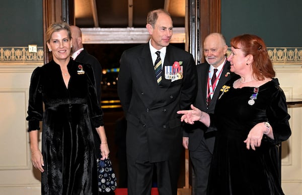 Prince Edward, Duke of Edinburgh, center, and Sophie, Duchess of Edinburgh, left, attend the Royal British Legion Festival of Remembrance at the Royal Albert Hall in London, Saturday Nov. 9, 2024. (Chris J. Ratcliffe/Pool Photo via AP)