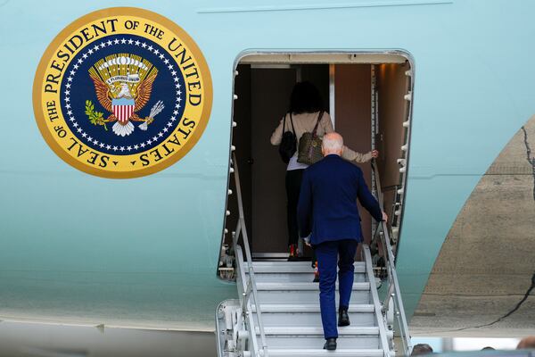 President Joe Biden boards Air Force One, with granddaughter Natalie Biden, to depart Joint Base Andrews, Md., Thursday, Nov. 14, 2024, en route to Lima, Peru to join other world leaders at the APEC Summit. (AP Photo/Jessica Rapfogel)