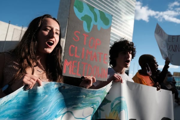 A group of students take part in a protest in support of the climate and against fossil fuel and other contributors to global warming in front of the United Nations (UN) in Manhattan on October 01, 2021 in New York City. (Photo Courtesy of Spencer Platt/Getty Images)