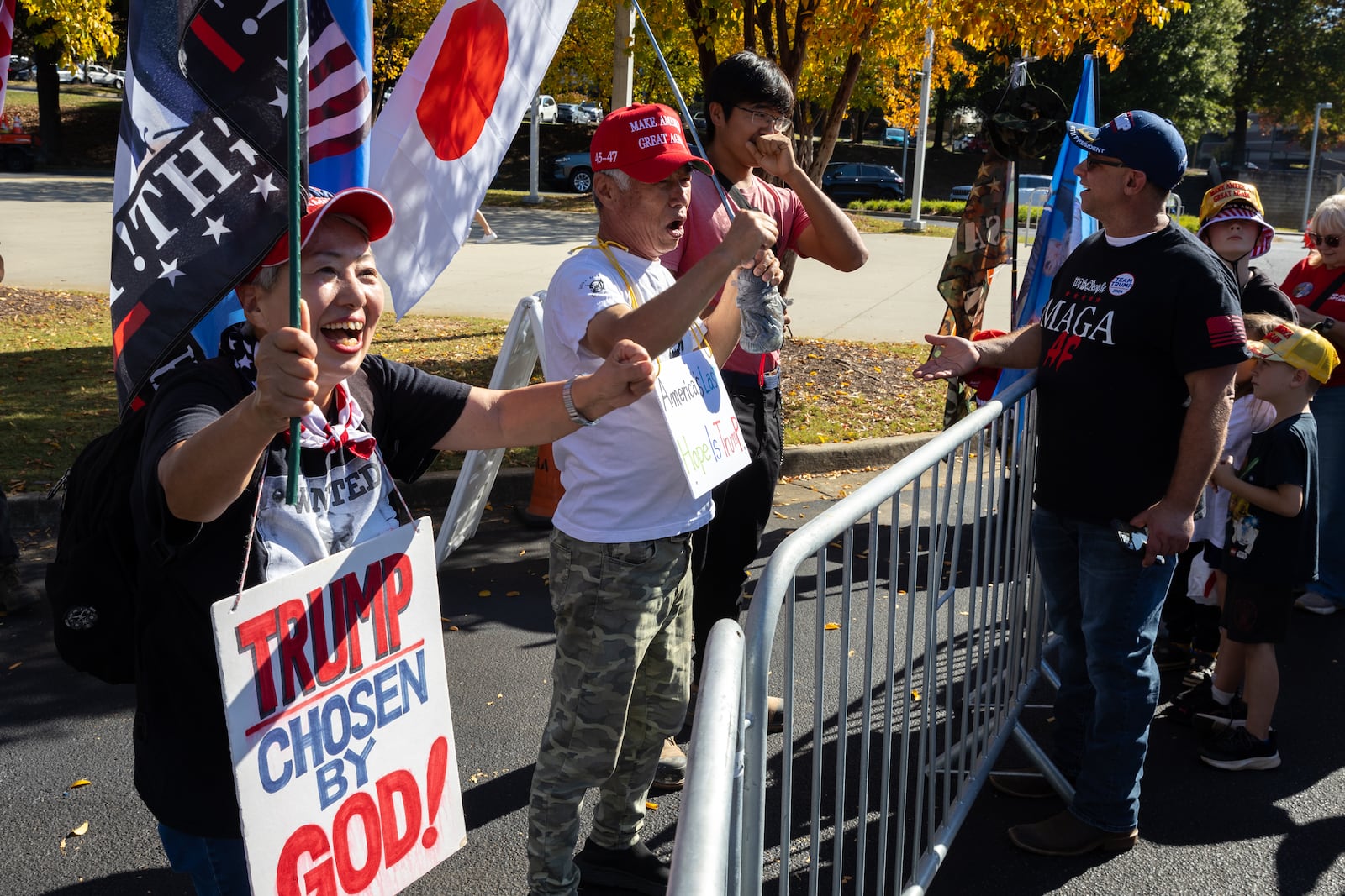 Supporters of former President Donald Trump show their support outside of his rally in Duluth last week.