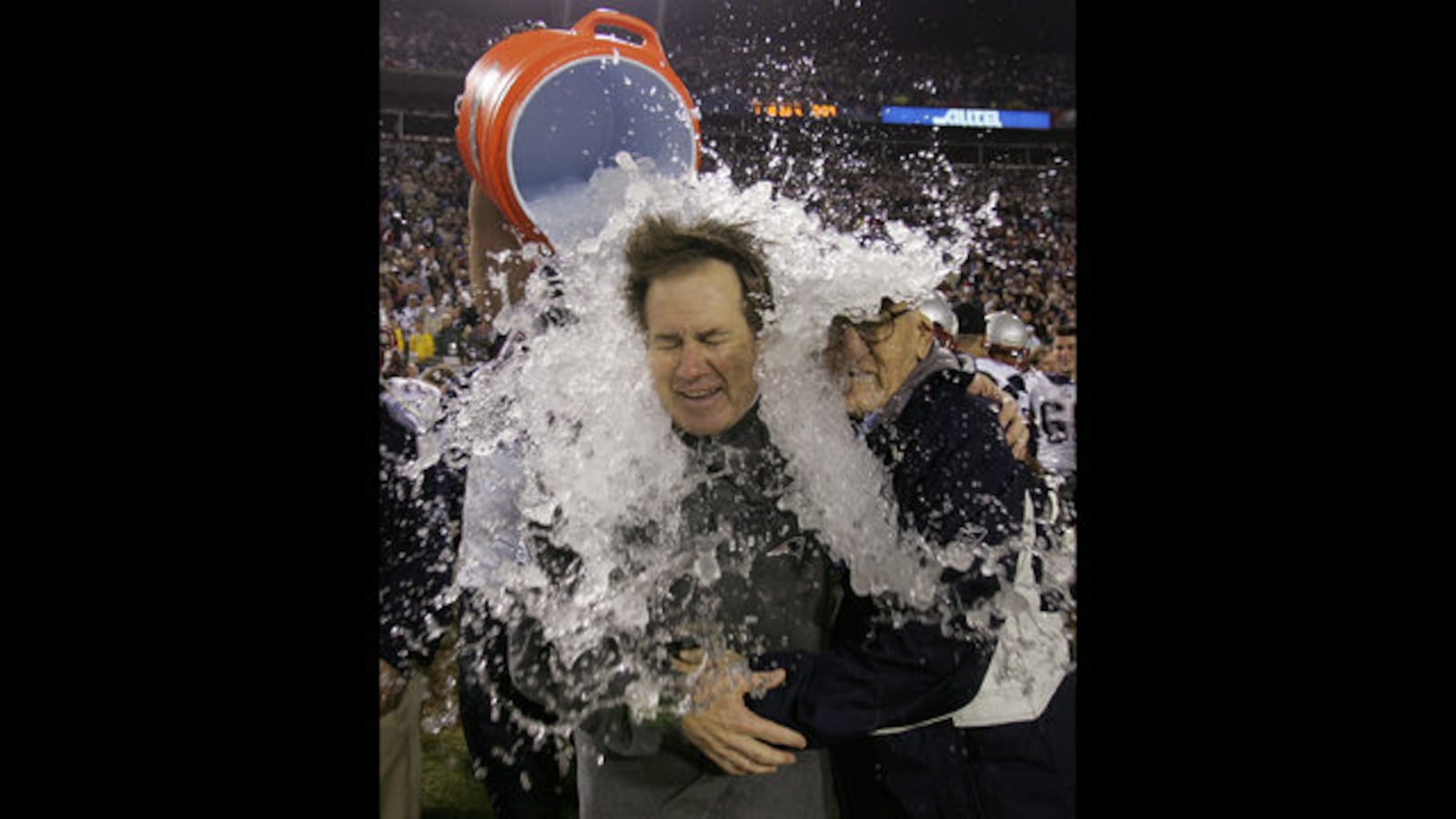 FILE PHOTO - In this Feb. 6, 2005, file photo, New England Patriots head coach Bill Belichick is doused after the Patriots beat the Philadelphia Eagles 24-21 in Super Bowl XXXIX at Alltel Stadium in Jacksonville, Fla. At right is Belichick's father, Steve. 