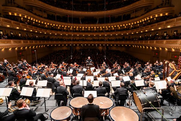 Semyon Bychkov, background center, conducts the Czech Philharmonic at Carnegie Hall in New York on Dec. 3, 2024. (Chris Lee/Carnegie Hall via AP)