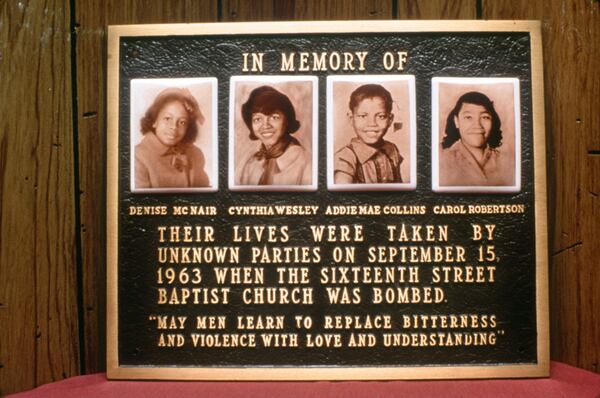 This memorial plaque at  the Sixteenth Street Baptist Church in Birmingham is a tribute to the girls murdered in the 1963 bombing of that church. Shown left to right are Denise McNair, Cynthia Wesley, Addie Mae Collins, and Carol Robertson. (Special to the AJC/David Lee)