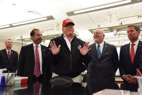 President Donald Trump speaks to the media Friday afternoon at the CDC.