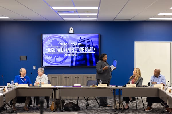 Board member Michael Heekin, Teresa Crawford, Elections Director Nadine Williams, member Julie Adams and vice chair Aaron Johnson appear during a break in the Fulton County Registration and Elections Board meeting in Union City on Tuesday, November 12, 2024.(Arvin Temkar / AJC)