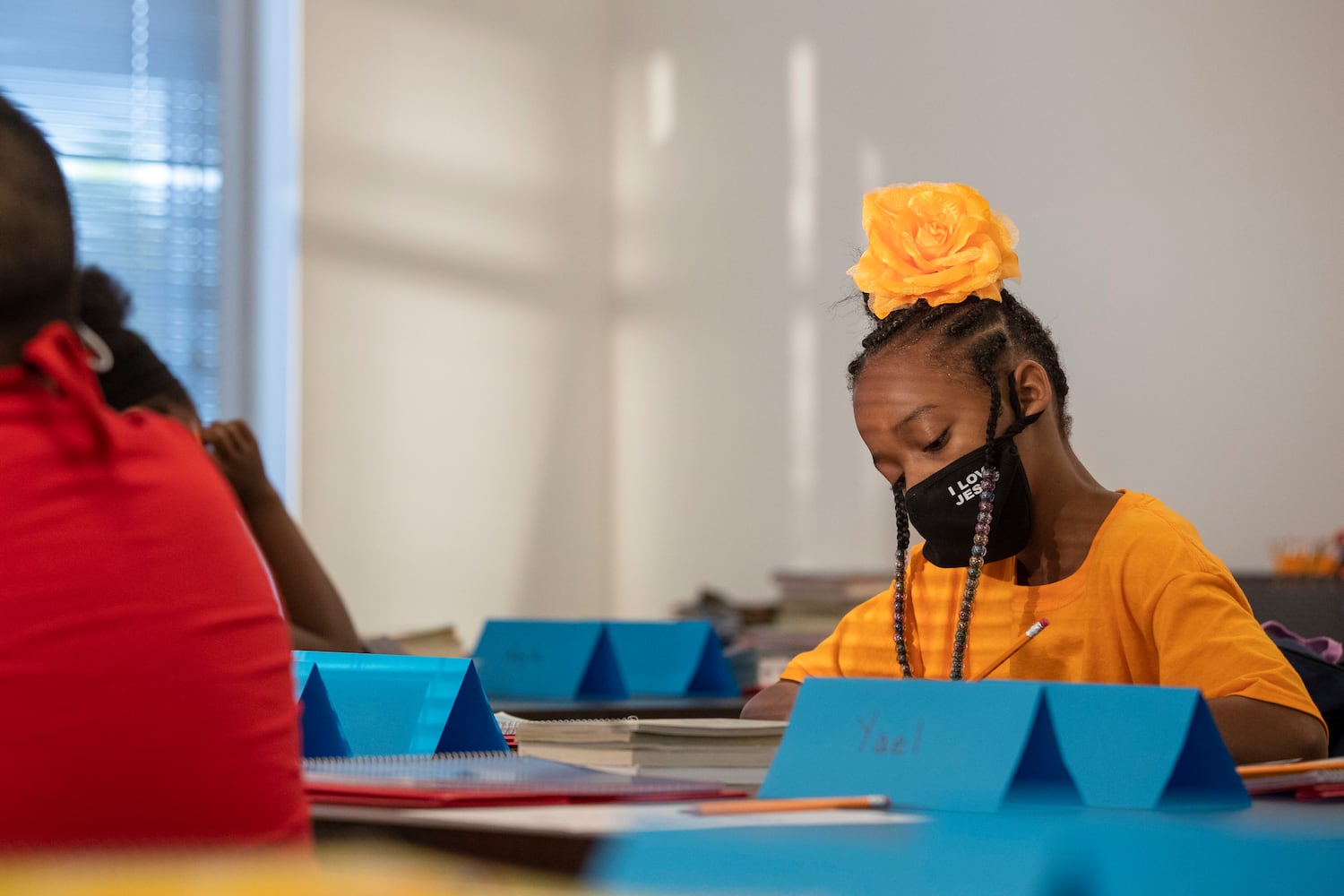 Atkinson Elementary School fourth-grader Runyia McKiver works on an assignment in her classroom at West Georgia Techinical College’s Coweta Campus in Newnan. (Alyssa Pointer / Alyssa.Pointer@ajc.com)