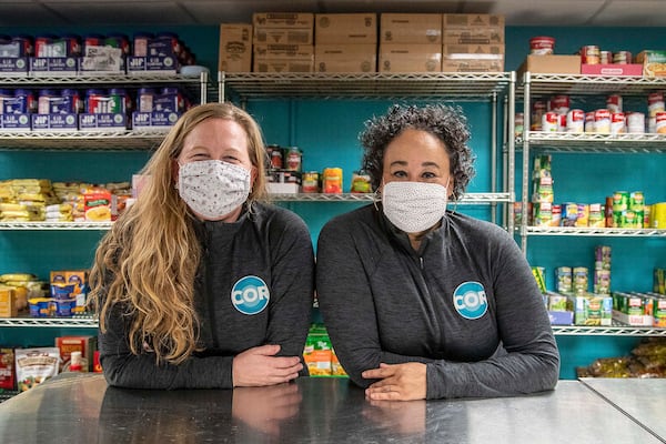 Jennifer Henn (left) and Jennifer Frisco Bartl are two of the three co-founders of COR, an Atlanta nonprofit that assists high school students living in poverty and experiencing trauma. (Alyssa Pointer / AJC file photo)