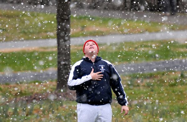 Derrick Milner reacts as snow started falling at Alexander Park in Lawrenceville on Saturday, February 8, 2020. (Photo: Hyosub Shin / Hyosub.Shin@ajc.com)