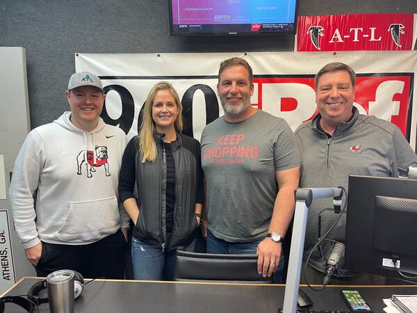 Mary Beth Smart poses with 960 The Ref radio hosts Logan Booker (L) and David Johnston (R), along with former Bulldog and family friend Russ Tanner (third from left) at the Cox Media Group studios in Athens on Friday, Nov. 19, 2021. (Photo by Logan Booker / Cox Media Group)