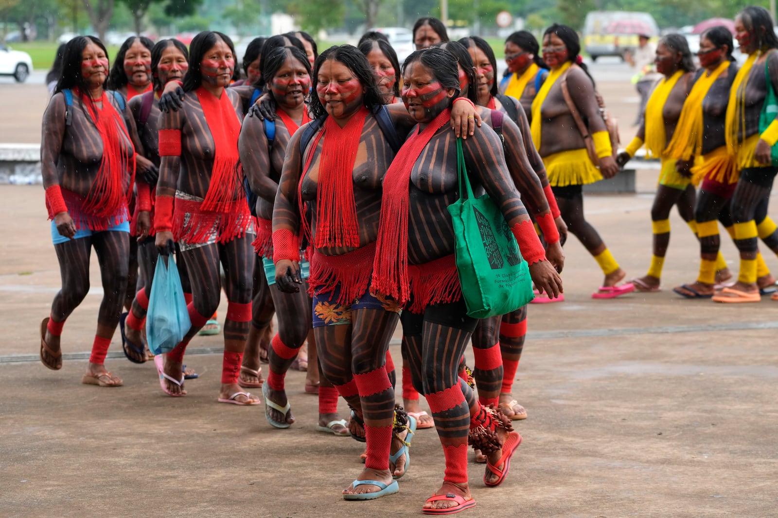 EDS NOTE: NUDITY - Indigenous women take part in protest against the prospective creation of a benchmark time limit that threatens to strip some of their lands, in Brasilia, Brazil, Wednesday, Oct. 30, 2024. (AP Photo/Eraldo Peres)