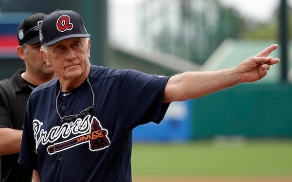 Former Major League baseball pitcher and hall of fame player Phil Niekro  waves to fans after he was introduced before a spring training baseball game between the Atlanta Braves and the Pittsburgh Pirates, Monday, March 13, 2017, in Kissimmee, Fla.