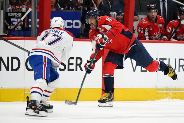 Washington Capitals left wing Alex Ovechkin (8) skates with the puck against Montreal Canadiens defenseman Jayden Struble (47) during the first period of an NHL hockey game, Thursday, Oct. 31, 2024, in Washington. (AP Photo/Nick Wass)