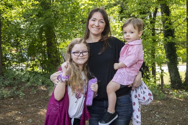 Alaya Horne (left) holds her diary as she poses with her mother, Shara, and her little brother, Killian, at their Johns Creek neighborhood. (Photo: ALYSSA POINTER / ALYSSA.POINTER@AJC.COM)