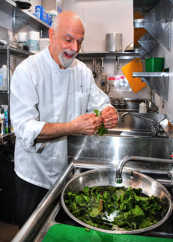 Chef Kameel Srouji of Aviva by Kameel, shown at the Collective at Coda location in Midtown Atlanta, demonstrates his personal method of washing chard before cooking. The very expressive Srouji likes to compare vegetables to any other living thing: "If you don't treat them carefully, they will bruise." (Chris Hunt for the AJC)