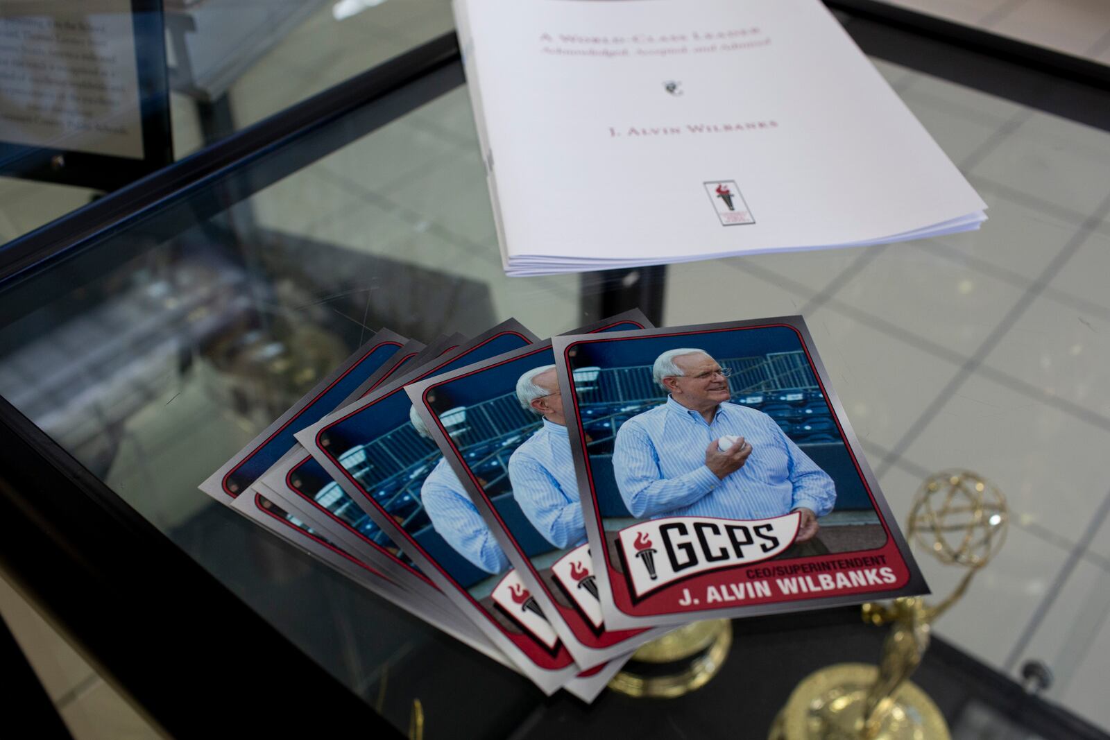 Baseball cards featuring J. Alvin Wilbanks are seen on a table at an informal send-off for Gwinnett County Schools superintendent J. Alvin Wilbanks at the J. Alvin Wilbanks Instructional Support Center in Suwanee, Georgia, on Wednesday, July 28, 2021. (Rebecca Wright for the Atlanta Journal-Constitution)