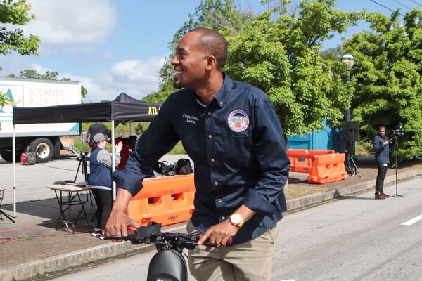 Councilman Antonio Lewis rides a scooter during the Atlanta Public School parade on Saturday, April 22, 2023, in Atlanta. The parade celebrated the 150-year anniversary of Atlanta Public Schools and featured students, teachers and other members of the Atlanta Public School community. CHRISTINA MATACOTTA FOR THE ATLANTA JOURNAL-CONSTITUTION