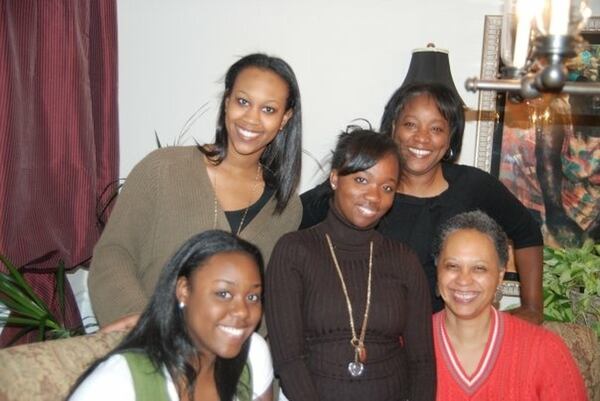 Though Gracie Bonds Staples' newspaper writing has usually been about other people, she occasionally included her family in her columns. This is what the after-Thanksgiving Day dinner glow looks like at the Staples residence. Pictured with Gracie (standing far right) are her daughters Jamila (center) and Asha (lower left), family friend who feels like a daughter Amanda Al-Mahdi (standing left), and friend Sheila Burks, Amanda’s mom. (Family photo)