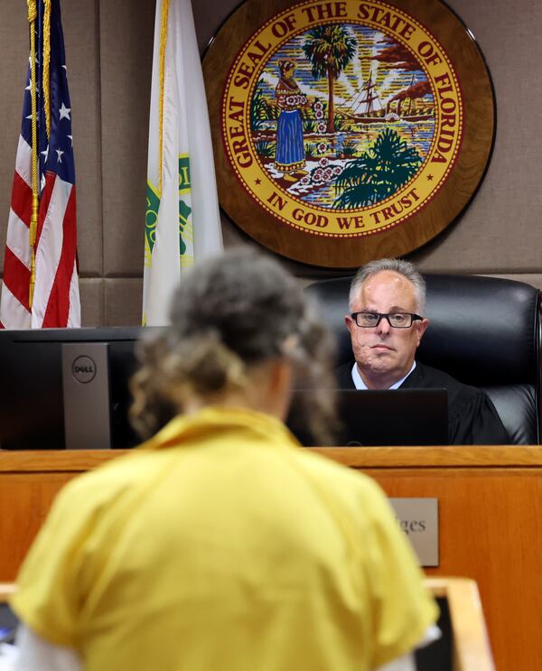 Judge Robert Hodges, right, listens as Susan Lorincz, who fatally shot a Black neighbor through her front door during an ongoing dispute, addresses the court during her sentencing hearing Monday, Nov. 25, 2024, in Ocala, Fla. (Bruce Ackerman/Ocala Gazette via AP, Pool)