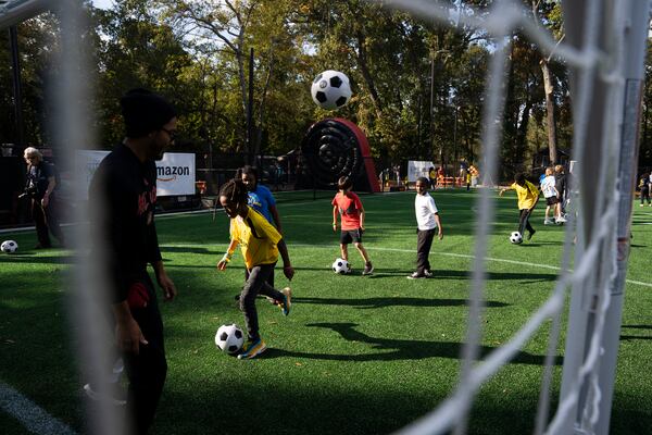  Kids play on  Soccer in the Streets'  new field at the East Lake Marta Station in Atlanta, Georgia on Friday, Oct, 27, 2023. (Olivia Bowdoin for the AJC).