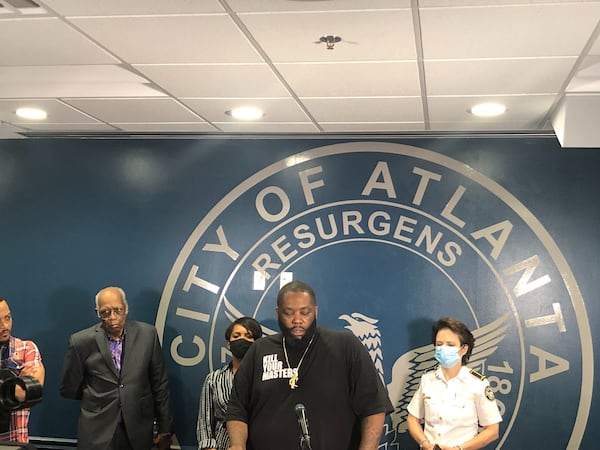 Rapper Killer Mike speaks Friday night during a news conference with Atlanta Mayor Keisha Lance Bottoms.