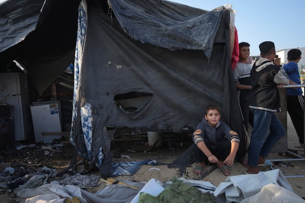 Palestinians gather at the site of an Israeli strike in the courtyard of the Al-Aqsa Hospital where displaced people live in tents, in Deir al-Balah, Gaza Strip, Saturday, Nov. 9, 2024. (AP Photo/Abdel Kareem Hana)