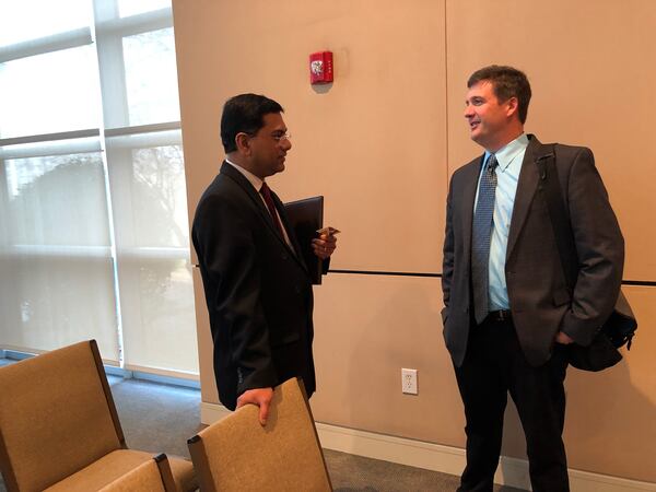 Sam Baker, the new transportation planning director for Henry County, speaks with Jim Jaquish, a local government affairs leader with the Atlanta Regional Commission.