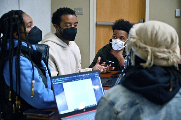 Cameron Williams (second from left) has a discussion with classmates during assistant political science professor Adrienne Jones’ constitutional law class at Morehouse College on Tuesday, Feb. 8, 2022. (Hyosub Shin / Hyosub.Shin@ajc.com)