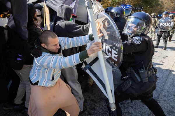 Protestors demonstrating against Atlanta’s public training safety center clash with police in Atlanta on Monday, November 13, 2023. (Arvin Temkar / arvin.temkar@ajc.com)