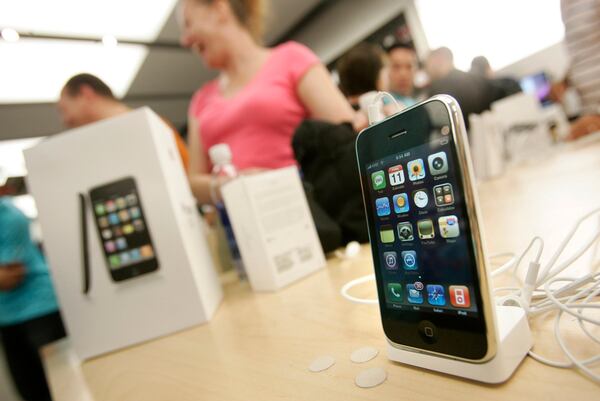 The new 3G iPhone is displayed on a table as customers buy the latest iPhone inside the Apple Store at Westfield Valley Fair in San Jose, Calif., on July 11, 2008. (Dai Sugano/Bay Area News Group/TNS)